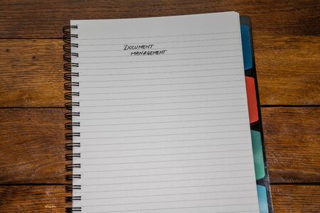Document management, handwriting text on page of office agenda, office spiral notebook. Copy space.の写真素材