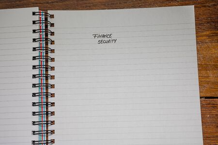Finance security, handwriting text on page of office agenda, office spiral notebook. Copy space.の写真素材