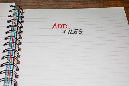 Add files, handwriting text on page of office agenda, office spiral notebook. Copy space.の写真素材