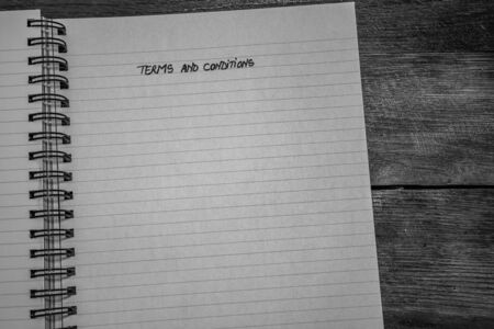 Terms and conditions, handwriting text on page of office agenda, office spiral notebook. Copy space.の写真素材