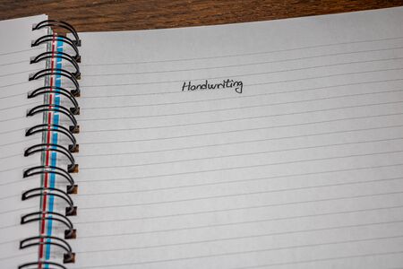 Handwriting text on page of office agenda, office spiral notebook. Copy space.の写真素材