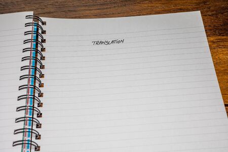 Translation, handwriting text on page of office agenda, office spiral notebook. Copy space.の写真素材