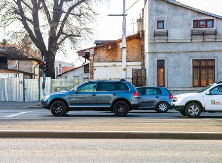 Car traffic at rush hour in downtown area. Car waiting at traffic light. Bucharest, Romania, 2019.のeditorial素材