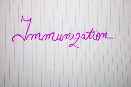 Immunization handwriting  text on paper, on office agenda. Copy space.の写真素材