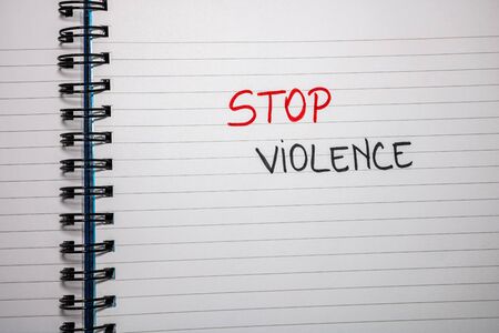 Stop violence handwriting  text on paper, on office agenda. Copy space.の写真素材