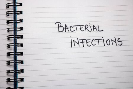 Bacterial infections handwriting  text on paper, on office agenda. Copy space.の写真素材