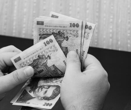 Hands counting money, counting LEI close upのeditorial素材