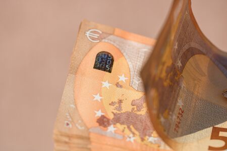 woman hands giving money like a bribe or tips. Holding EURO banknotes on a blurred background, EU currencyのeditorial素材