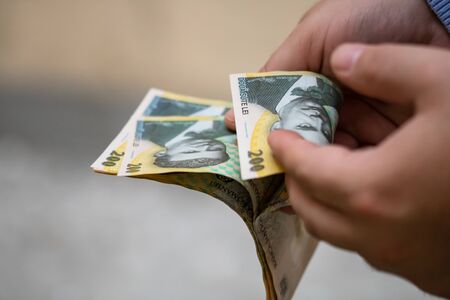 Hands counting money, counting LEI close upのeditorial素材