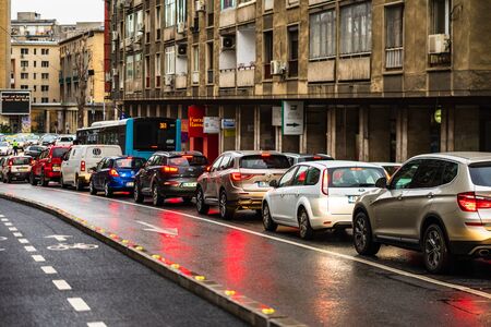 Car traffic at rush hour on the main boulevard in Bucharest downtown. Rainy morning, rainy evening during winter in Bucharest, Romania, 2020のeditorial素材
