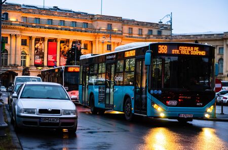 Car traffic at rush hour on the main boulevard in Bucharest downtown. Rainy morning, rainy evening during winter in Bucharest, Romania, 2020のeditorial素材
