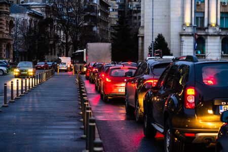 Car traffic at rush hour on the main boulevard in Bucharest downtown. Rainy morning, rainy evening during winter in Bucharest, Romania, 2020のeditorial素材