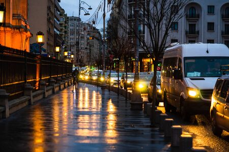 Car traffic at rush hour on the main boulevard in Bucharest downtown. Rainy morning, rainy evening during winter in Bucharest, Romania, 2020のeditorial素材