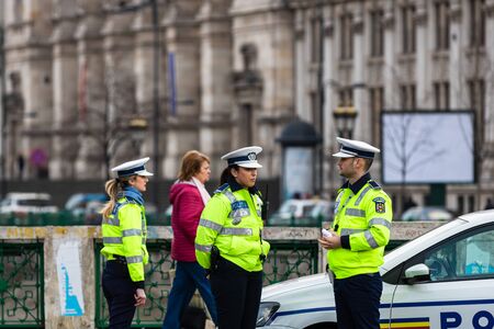 Police agent, Romanian Traffic Police (Politia Rutiera) directing traffic during the morning rush hour in downtown Bucharest, Romania, 2020のeditorial素材