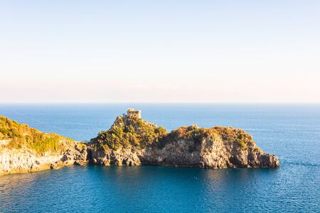 Old medieval castle tower, the Amalfi Coast (Italy), with sea views and surrounded by trees and rocksのeditorial素材