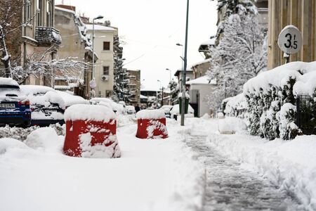 Snow on cars in the morning. Winter season and icy cars on the road in morning rush hour traffic of Bucharest, Romania, 2020のeditorial素材