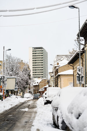 Snow on cars in the morning. Winter season and icy cars on the road in morning rush hour traffic of...