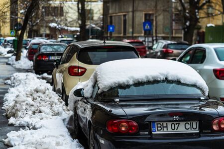 Winter season and icy cars on the road in the morning rush hour traffic in Bucharest, Romania, 2020のeditorial素材