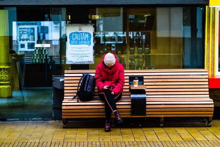 Travelers and commuters waiting for a train on the train platform at Bucharest North Railway Station (Gara de Nord Bucharest) in Bucharest, Romania, 2020のeditorial素材