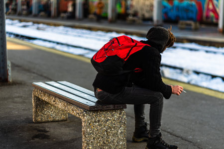 Travelers and commuters waiting for a train on the train platform at Bucharest North Railway Station...