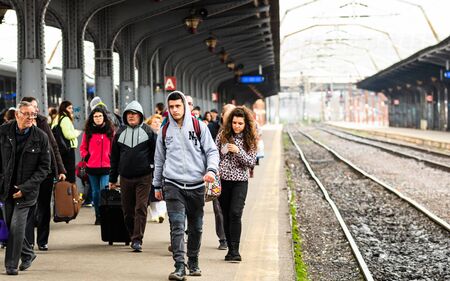 Travelers and commuters waiting for a train on the platform of Bucharest North Railway Station (Gara de Nord) in Bucharest, Romania, 2020のeditorial素材
