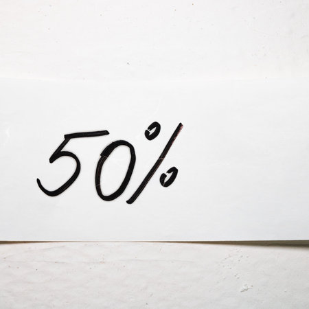 Writing 50 percent on white label on white background.