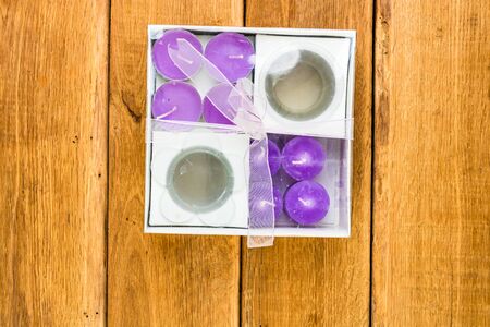 Detail view of candles on wooden background, top view, copy space for text, close up photoの写真素材