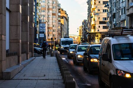 Car traffic at rush hour in downtown area of the city. Car pollution, traffic jam in the morning and evening in the capital city of Bucharest, Romania, 2020のeditorial素材