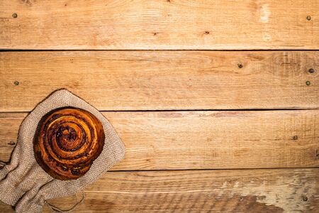 Fresh puff pastry on wooden table. Coffee, food and breakfast concept. Desserts, fresh pastries, biscuits and coffee. Top view and copy spaceの写真素材
