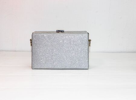 Glittery silver clutch bag isolated on white background with copy space.の写真素材