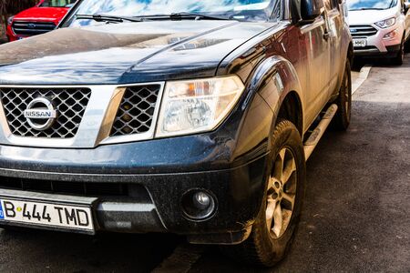 Detail view of dirty Nissan car, dirty wheels. Bucharest, Romania, 2020.のeditorial素材