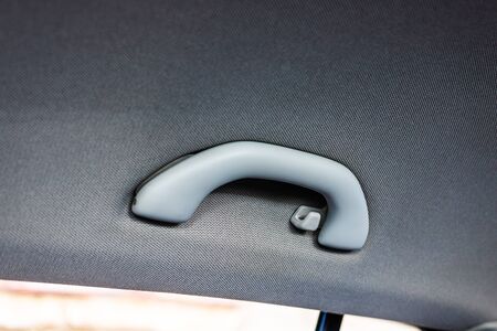 Close up photo inside a car, roof handle isolated.の写真素材