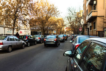 Car traffic at rush hour in downtown area of the city. Car pollution, traffic jam in the morning and evening in the capital city of Bucharest, Romania, 2020のeditorial素材