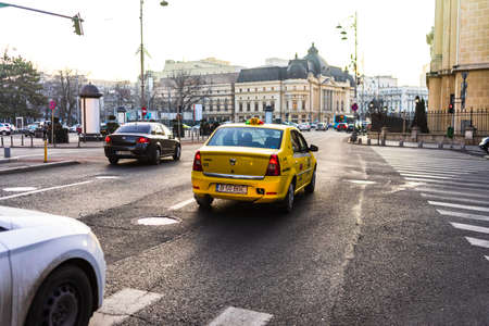 Car traffic at rush hour in downtown area of the city. Car pollution, traffic jam in the morning and evening in the capital city of Bucharest, Romania, 2020のeditorial素材