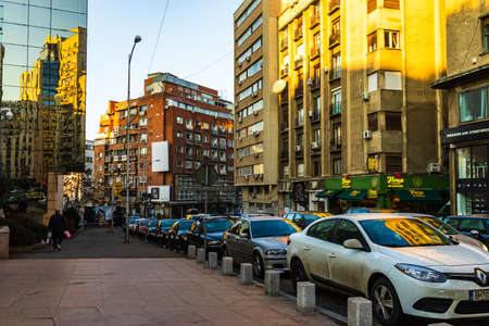 Car traffic at rush hour in downtown area of the city. Car pollution, traffic jam in the morning and evening in the capital city of Bucharest, Romania, 2020のeditorial素材