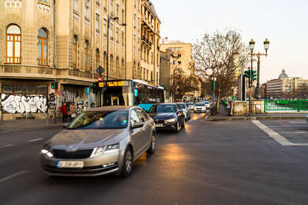 Car traffic at rush hour in downtown area of the city. Car pollution, traffic jam in the morning and evening in the capital city of Bucharest, Romania, 2020のeditorial素材