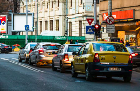 Car traffic at rush hour in downtown area of the city. Car pollution, traffic jam in the morning and evening in the capital city of Bucharest, Romania, 2020のeditorial素材