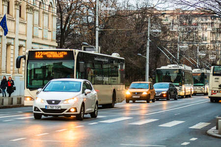 Car traffic at rush hour in downtown area of the city. Car pollution, traffic jam in the morning and evening in the capital city of Bucharest, Romania, 2020のeditorial素材