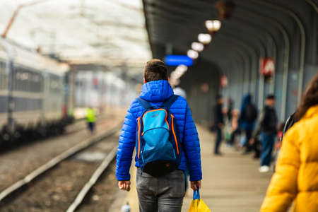 Travelers and commuters carry luggage and backpacks on the train platform of Bucharest North Railway Station (Gara de Nord Bucharest) in Bucharest, Romania, 2020のeditorial素材
