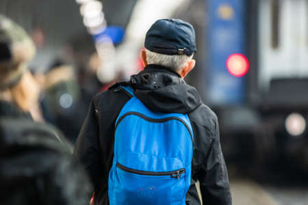 Old man with backpack on the train platform of Bucharest North Railway Station (Gara de Nord Bucharest) in Bucharest, Romania, 2020のeditorial素材