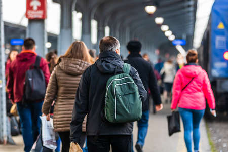 Travelers and commuters carry luggage and backpacks on the train platform of Bucharest North Railway Station (Gara de Nord Bucharest) in Bucharest, Romania, 2020のeditorial素材