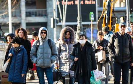 Covid-19 flu disease virus spreading in Europe. People wearing medical mask against coronavirus....