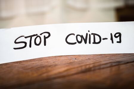 Stop COVID-19 writing on white label. Covid-19 flu disease virus spreading in Europe.の写真素材