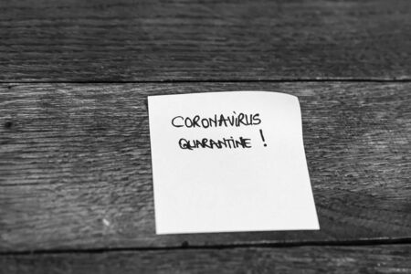 Writing Coronavirus Quarantine on memo post remider. Covid-19 flu disease virus spreading in Europe.の写真素材