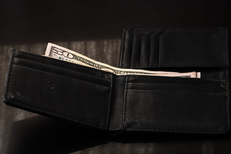 Man wallet with money on the table, wallet with dollarsの写真素材