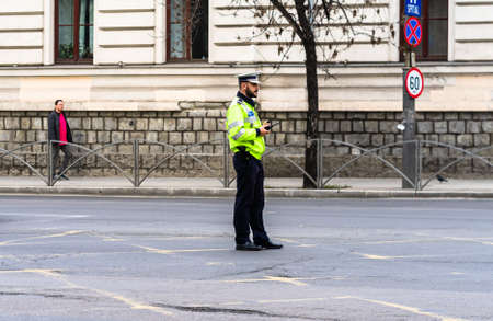 Romanian Police (Politia Rutiera) directing traffic and patrolling streets to avoid curfew breaches amid the spread of the Coronavirus COVID-19 in downtown Bucharest, Romania, 2020のeditorial素材