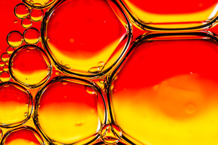 Abstract colorful backdrop with oil drops and waves on water surface. Abstract background concept