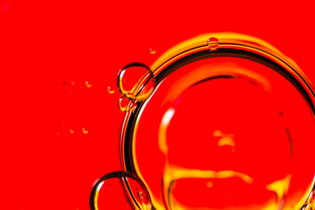 Abstract colorful backdrop with oil drops and waves on water surface. Abstract background concept
