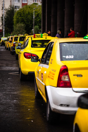 Car in traffic, modern city taxi service. Taxi cars parked at the taxi station in the capital city...