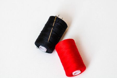 colorful spools of sewing thread isolated on white backgroundの写真素材